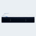 Side profile view of the 13-inch DreamCloud Premier Hybrid Mattress featuring navy blue supportive side panels and a plush white quilted surface.
