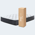 Sierra Sleep 13.5 Inch Pillow Top Mattress next to its convenient bed-in-a-box shipping carton in a studio setting.