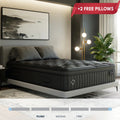 Master bedroom scene displaying the Black Diamond Lux 15-inch mattress with a promo badge for free pillows and a plush firmness scale.
