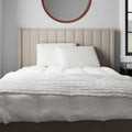 Malouf HyperChill pillow protectors on a bed providing a clean, temperature-regulated sleep.
