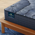 Detailed close-up of Serta Perfect Sleeper X Kendall branding and premium hybrid mattress fabric.
