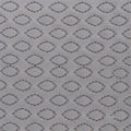 Close-up of the grey textured performance fabric on a Cosmo pillow designed for maximum airflow.