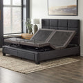 Split King Malouf M455 adjustable foundation placed inside a dark grey upholstered bed frame with head sections raised.
