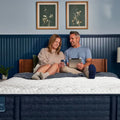 Couple relaxing on a Serta iComfortPRO Chelsea 12" medium mattress, providing balanced comfort and support.
