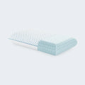 Malouf cooling pillow cutaway showing the quilted cover over a blue ventilated gel memory foam core.
