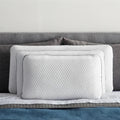 Two stacked Malouf Weekender pillows showing supportive loft for back, side, and stomach sleepers.