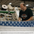 Artisan bedsmith handcrafting a WinkBed in a factory, emphasizing the brand's commitment to skilled labor and exclusive USA manufacturing.

