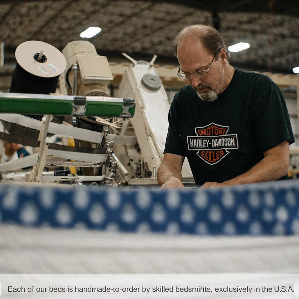 Artisan bedsmith handcrafting a WinkBed Plus mattress in the USA, highlighting the heavy-duty build quality for long-lasting durability.
