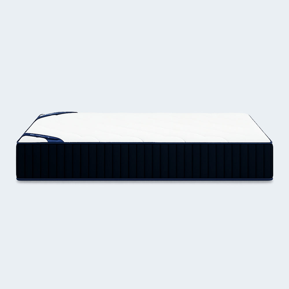 Frontal symmetrical view of the DreamCloud Classic 12-inch Medium Firm Hybrid Mattress highlighting the premium quilted cover and branding.
