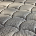 Detailed macro shot of the DreamCloud signature breathable quilted cover fabric optimized for moisture-wicking and comfort.
