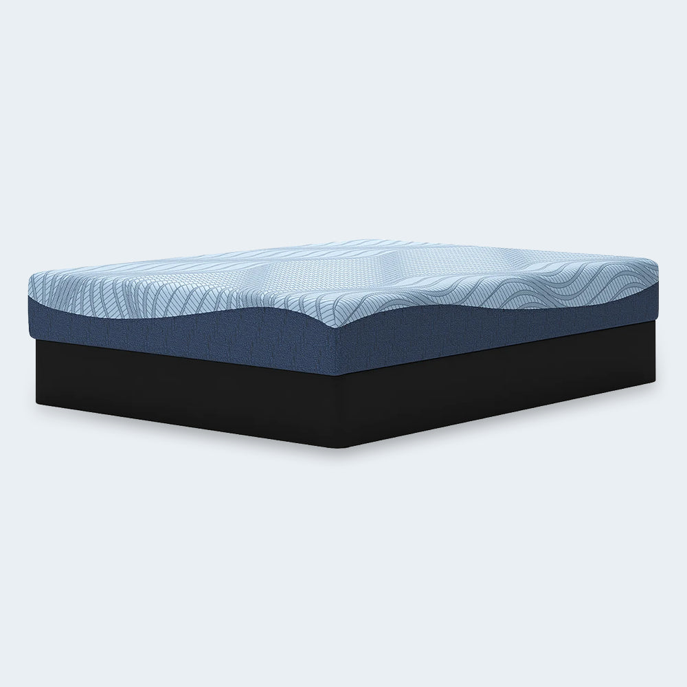 Perspective studio shot of the Peak 2.0 Memory Foam 10-inch Mattress highlighting the modern two-tone blue design and medium-firm support profile.
