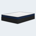 Side perspective of the 6-inch firm mattress by Ashley Sleep featuring navy blue side panels and a slim, low-profile design for bunk beds or guest rooms.

