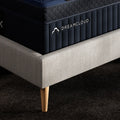Close-up corner shot of the DreamCloud Ultra 15-inch mattress showing the premium embroidered logo and reinforced carrying handle.
