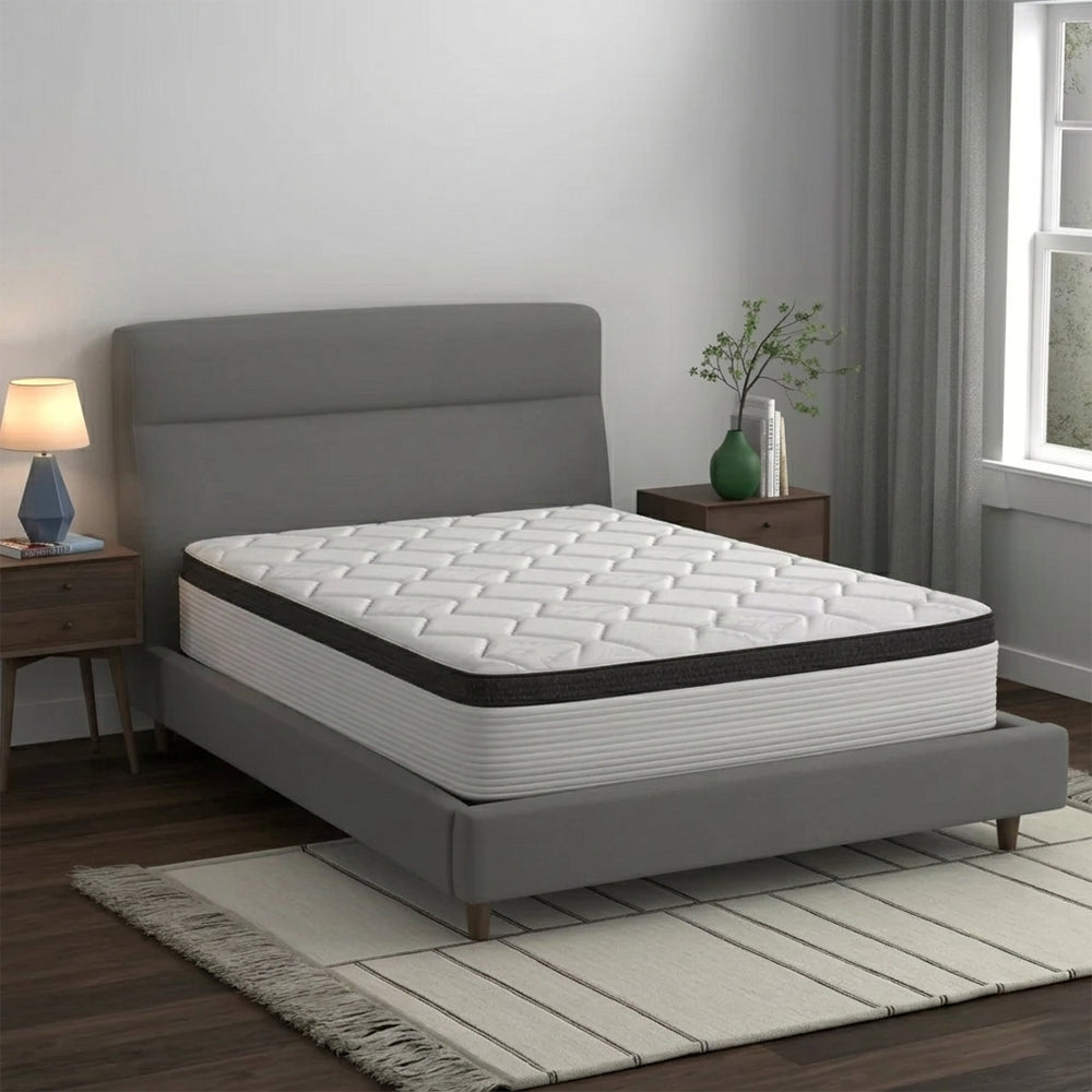 Perspective view of the American Bedding Cymbal Jingle 12-inch Hybrid Euro Top Mattress featuring a plush quilted surface and modern grey-and-white design.
