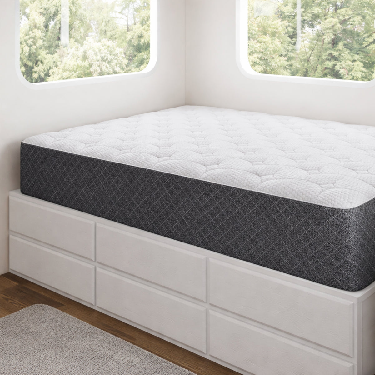 Front view of the RV 10" Foam Mattress by GhostBed styled on a white storage platform in a bright modern room.