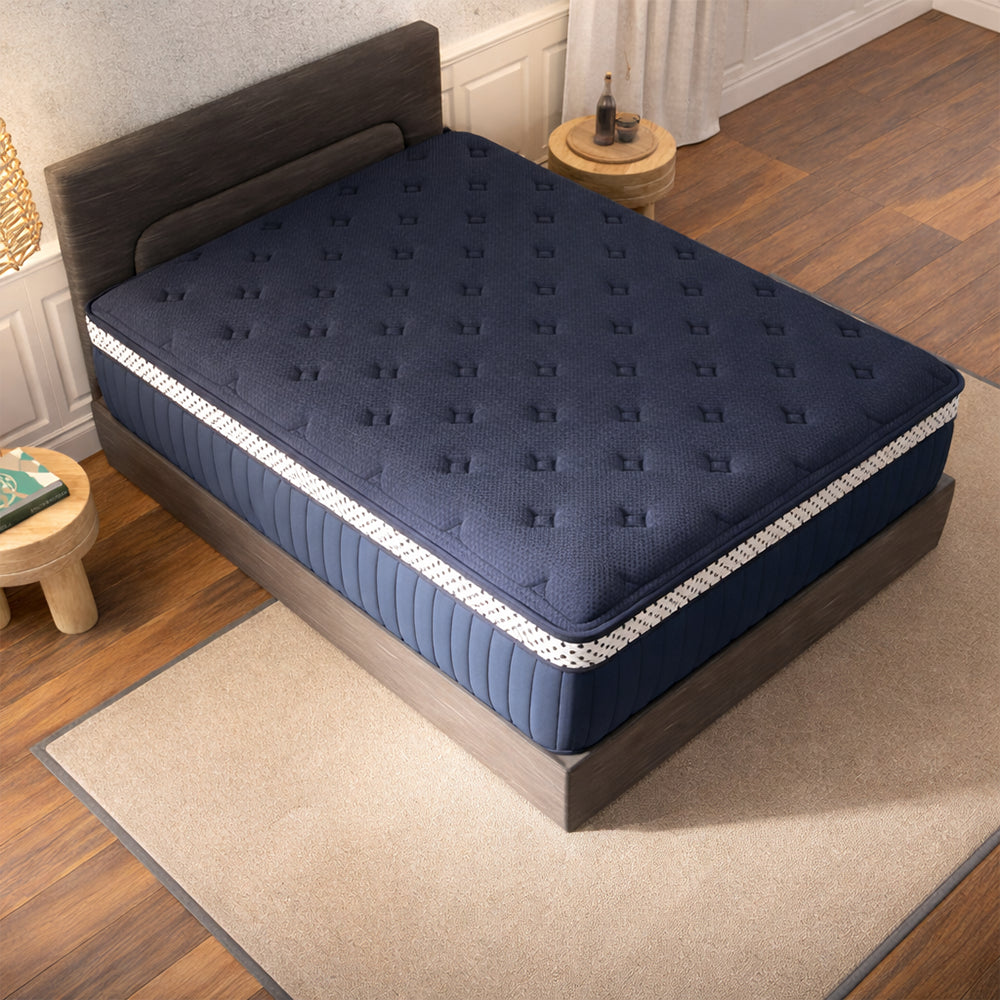 Overhead view of the WinkBeds Blue luxury firm hybrid mattress in a contemporary bedroom setting, highlighting its high-profile 15-inch design.

