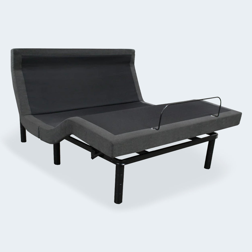 Three-quarter view of the iDealBed Smart 6i adjustable bed frame in a full sitting position with a mattress retainer bar.
