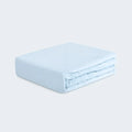 Folded light blue BEDGEAR Hyper-Wool performance crib sheet for a refreshing and breathable nursery.
