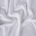 Soft white Hyper-Linen fabric texture for a moisture-wicking and comfortable baby bedding surface.
