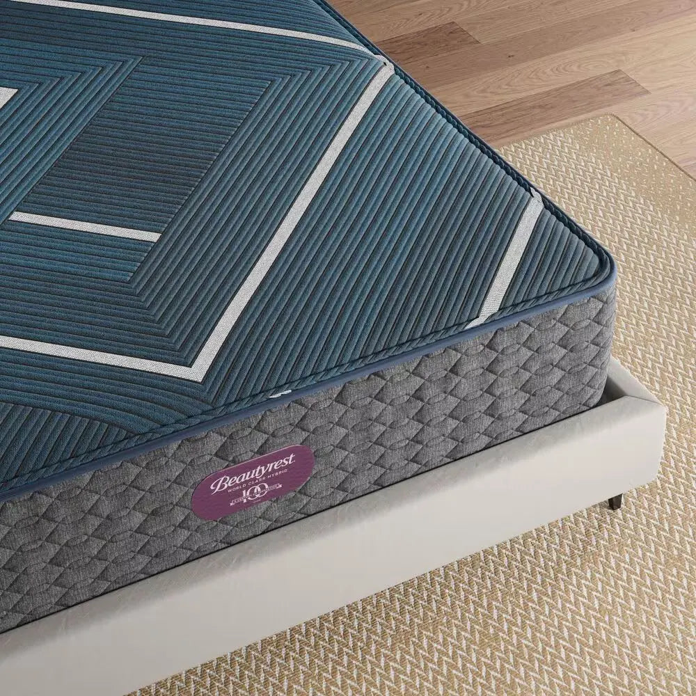 Detailed corner view of the Simmons Beautyrest World Class Hybrid mattress on a designer bed frame.
