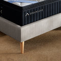 Close-up corner detail of the DreamCloud Premier mattress illustrating the reinforced edge support and high-end fabric upholstery.
