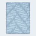 Overhead top-down view of the Peak 2.0 10-inch mattress surface featuring a signature light blue wave textured stretch-knit cooling cover.
