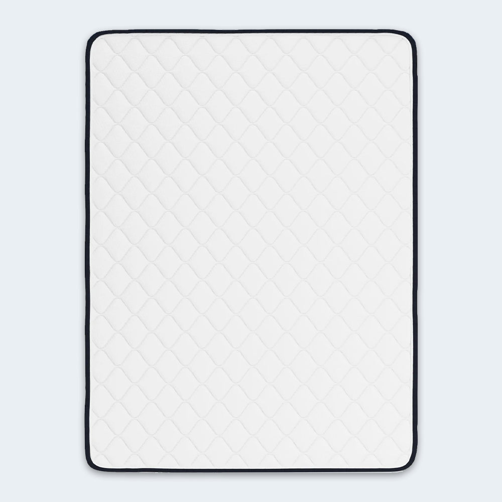 Overhead top view of the Ashley 6-inch Firm Mattress highlighting the breathable white sleep surface and diamond-quilted pattern.

