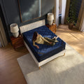 Overhead top-down view of the DreamCloud Ultra mattress surface featuring the elegant navy blue textured pattern and cooling performance fabric.
