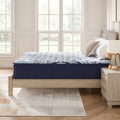 Side profile view of the Ashley Luxe 2.0 Blue 15-inch mattress on a modern wooden bed frame highlighting the deep luxury comfort layers.
