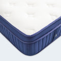 Detailed close-up of the Weekender 11-inch hybrid mattress corner featuring reinforced piping and breathable white quilted fabric.
