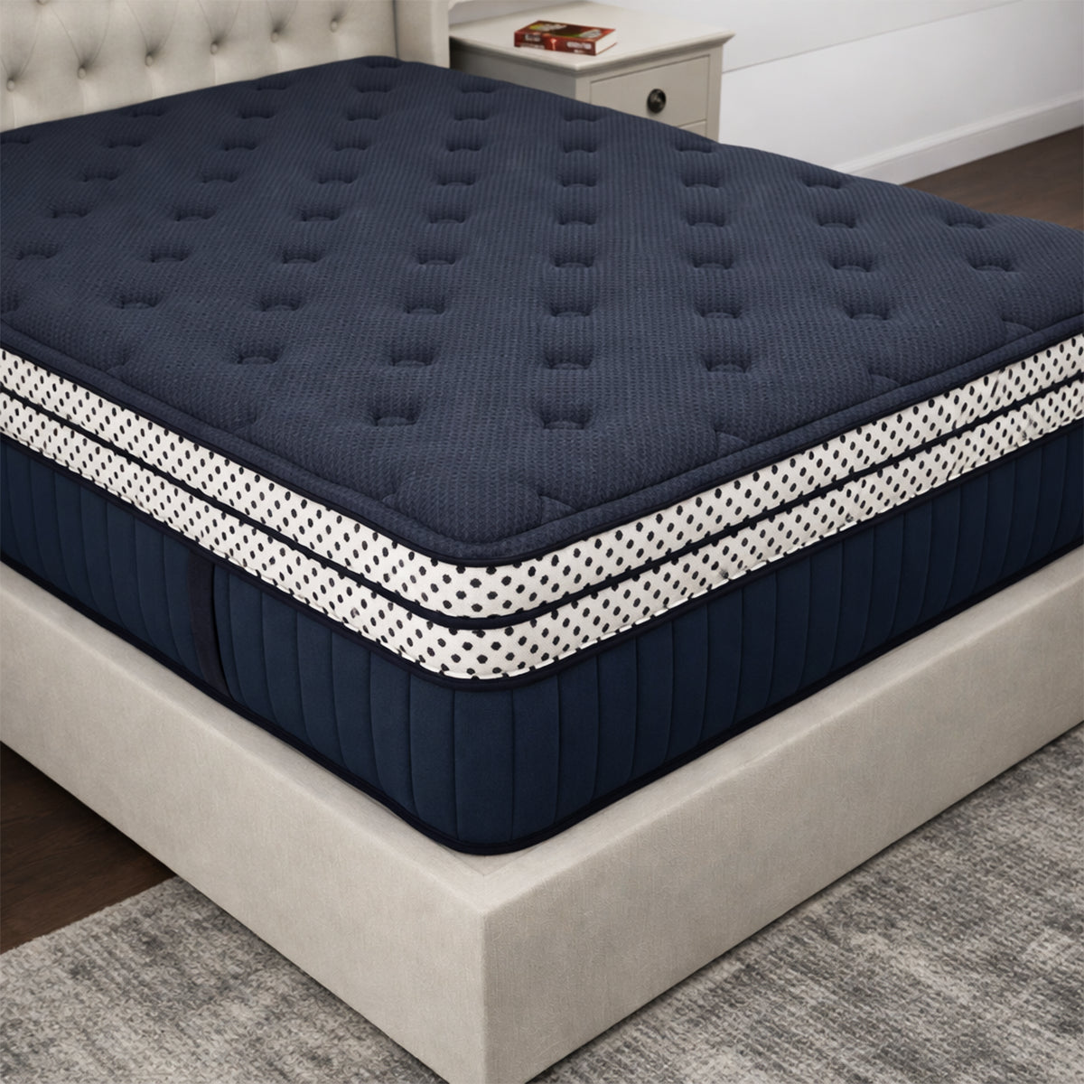 Close-up of the 17'' mattress corner detailing the premium navy fabric and thick double box top construction.