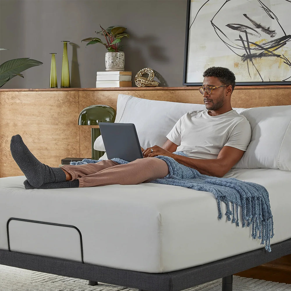 Ergonomic head tilt on the Baselogic Platinum base, ideal for sitting up to work on a laptop or reading in bed with proper support.
