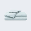 Stacked light blue BEDGEAR Ver-Tex cooling sheet set for refreshing, temperature-regulated sleep.
