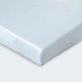 Secure fitted corner of a light blue moisture-wicking BEDGEAR Dri-Tec crib sheet.
