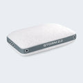 Comfortable woman hugging a plush BEDGEAR Storm 2.0 cooling pillow for a cozy, restful sleep.
