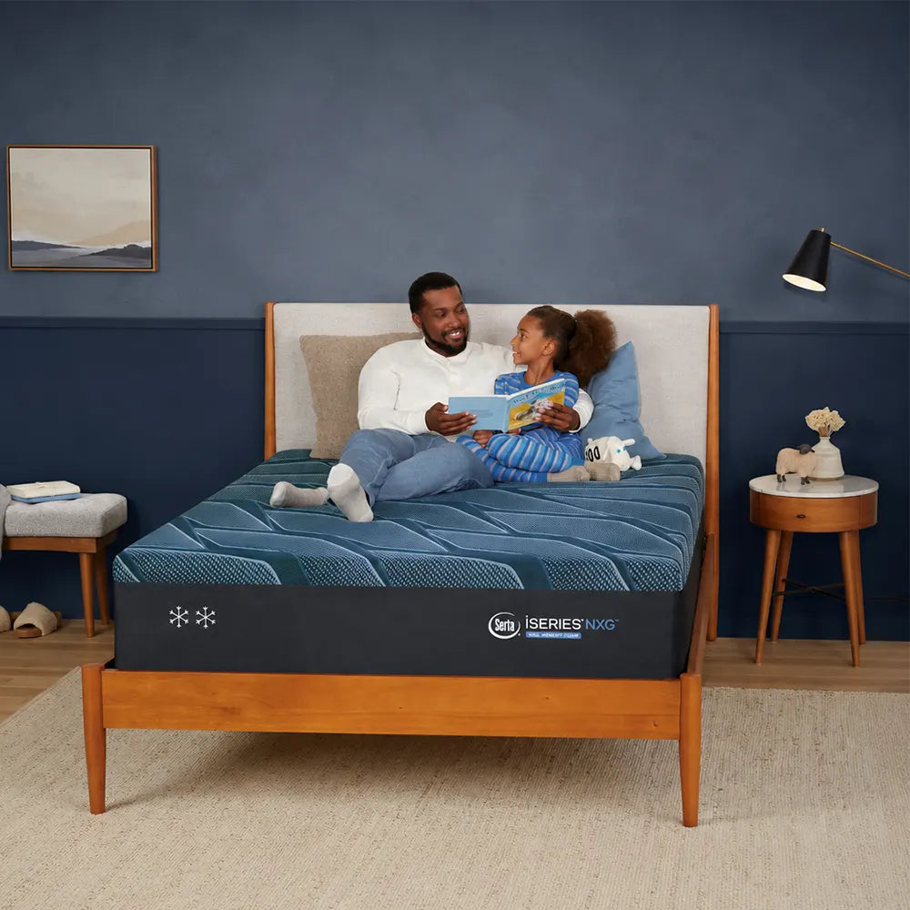 Father and daughter on a Serta iSeries NXG 2500 mattress, demonstrating superior motion isolation technology.
