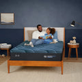 Father and daughter on a Serta iSeries NXG 2500 mattress, demonstrating superior motion isolation technology.
