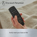 Close-up of the Baselogic wireless remote highlighting the one-touch flat preset button for a quick reset to a flat sleeping position.

