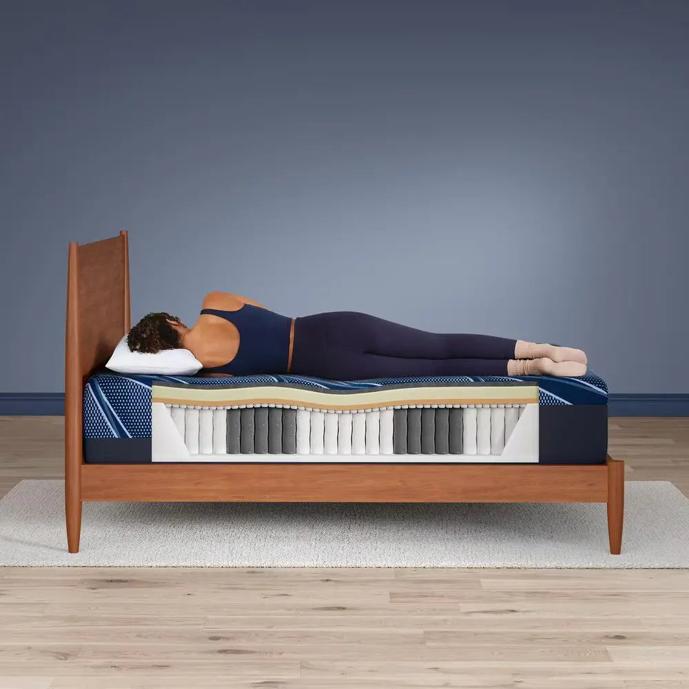 Side sleeper on Serta iSeries NXG hybrid mattress showing perfect spinal alignment and plush comfort.
