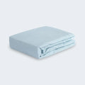 Folded light blue BEDGEAR Hyper-Linen performance crib sheet for a soothing, breathable nursery.

