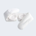 Woman adjusting the white BEDGEAR Hyper-Silk Sleep Mask for a personalized, light-blocking sleep experience.
