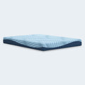 Side-angle view of the Ashley Peak 2.0 8-inch Memory Foam Mattress showing the signature light blue wave pattern and navy side panels.
