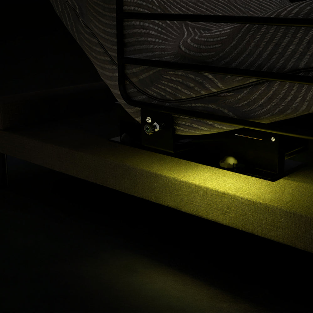 Integrated under-bed LED safety lighting on the Customatic Independence bed frame for nighttime visibility.
