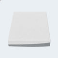 Top-down studio perspective of the EcoCore Hybrid Deluxe mattress showing the geometric patterned white cover.
