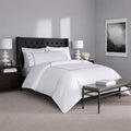 Luxury white and silver double-stripe sheet set by SleepTone for a high-end hotel feel at home.
