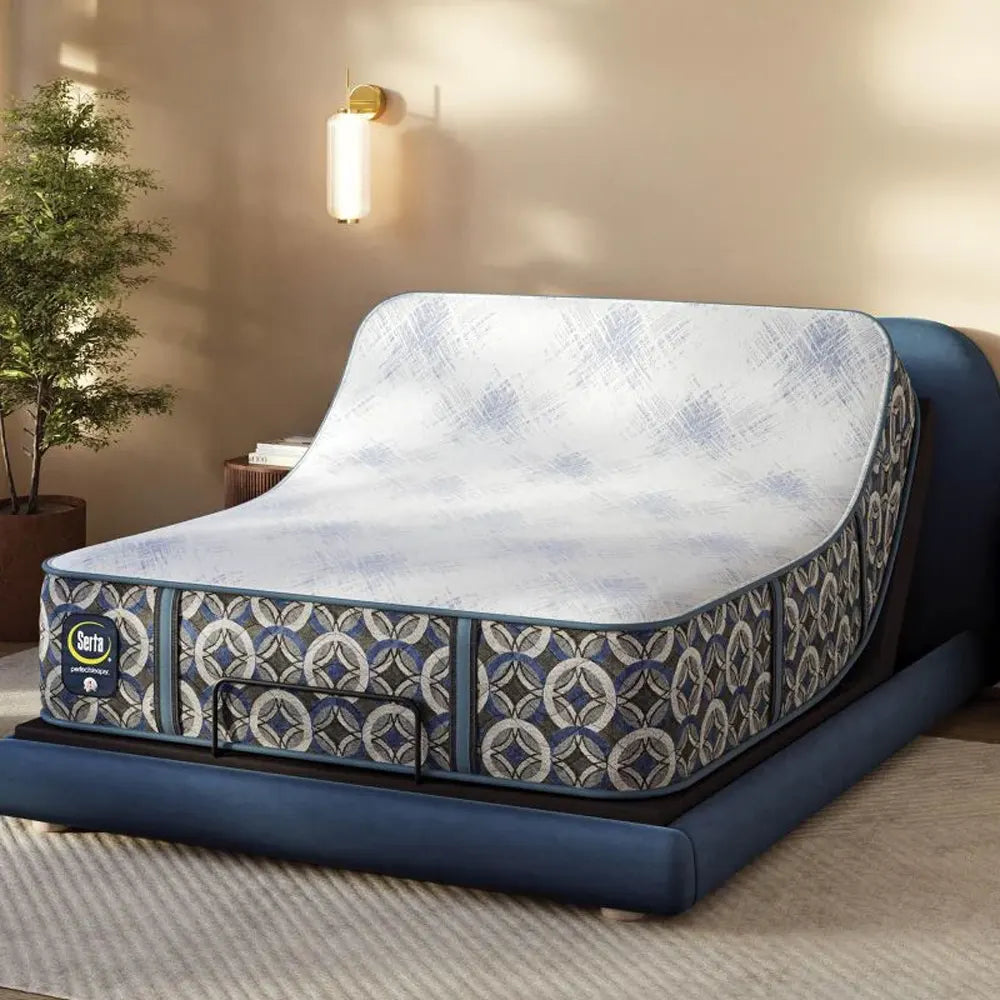 Serta Cascade Bluff Hybrid Plush mattress on an adjustable base in a head-up position for custom comfort.
