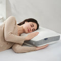 Side sleeper woman resting on a Sleeptone IceTone cooling pillow with pressure-relieving memory foam.
