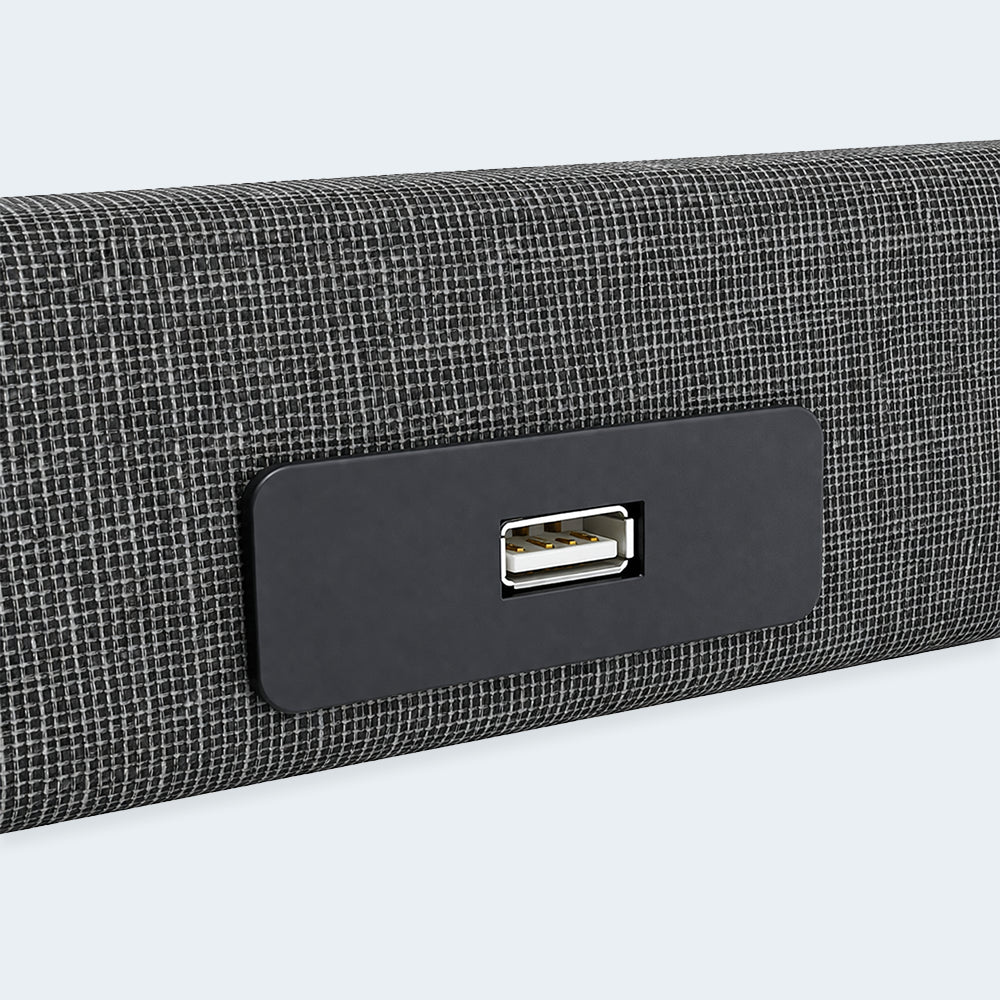 Side-mounted USB charging port on the Independence bed upholstery for convenient device power access.
