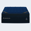 Frontal view of the navy blue DreamCloud Ultra 15-inch mattress featuring a high-density support core and luxury scalloped quilted finish.
