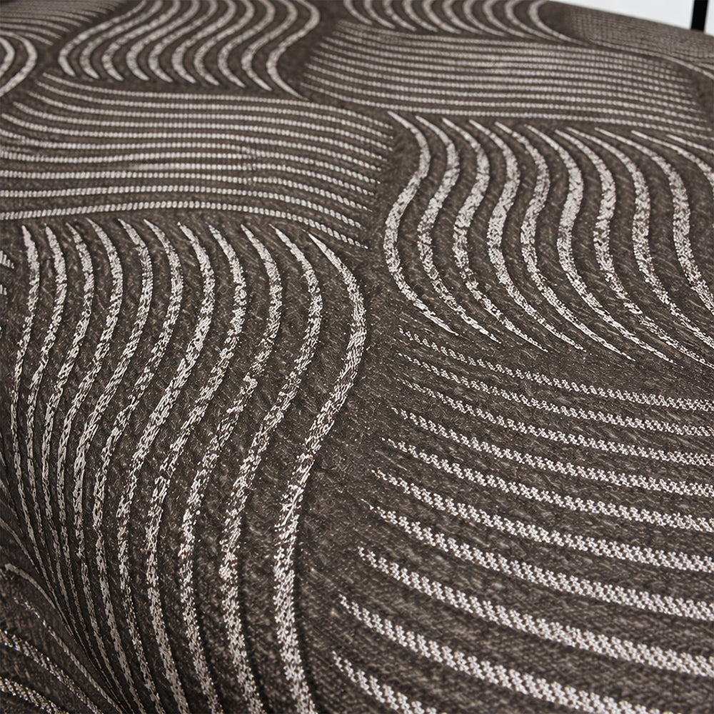 Close-up of the grey wave-textured breathable fabric used on the Customatic Independence luxury lift bed.
